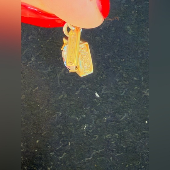 Coach gold tone necklace. Dangly gem with gold around with coach tag. - Picture 3 of 6